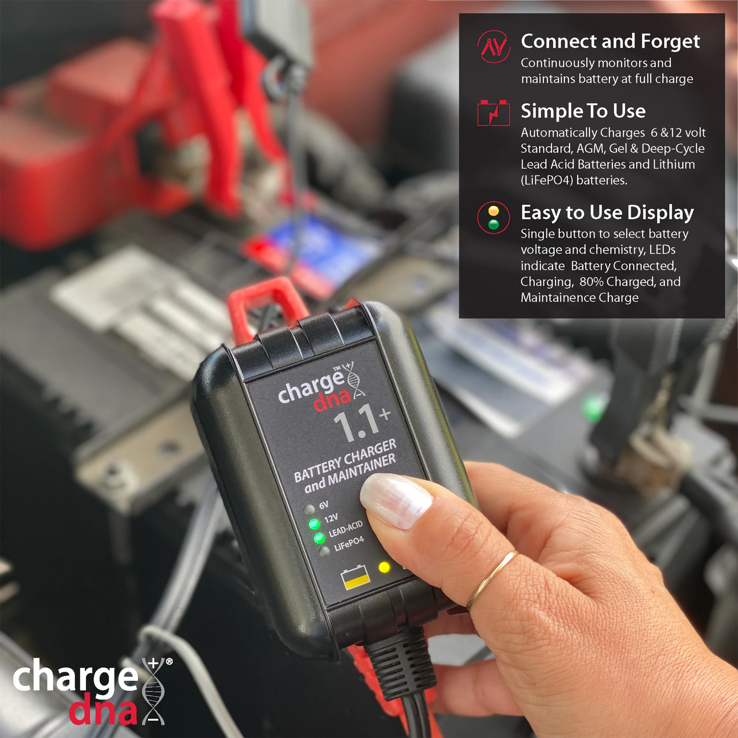 Photo showing someone setting up a ChargeDNA 1.1+ to charge a battery in a vehicle